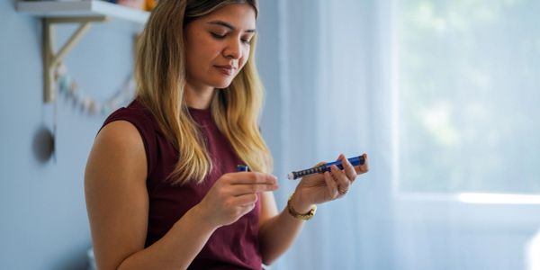 woman looking at GLP-1 medication
