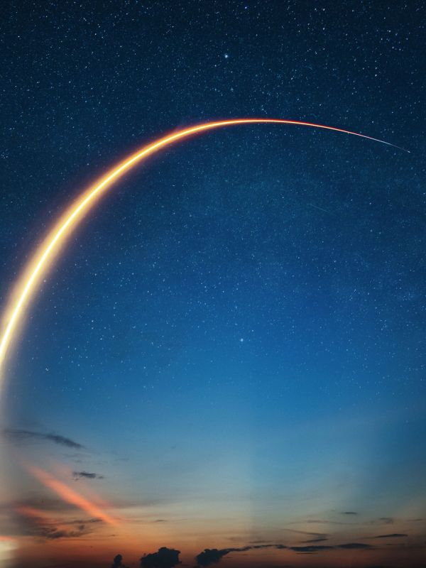 Rocket launch lighting up the night sky.