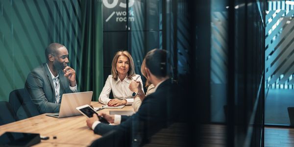Executive leaders in a strategic advisory meeting