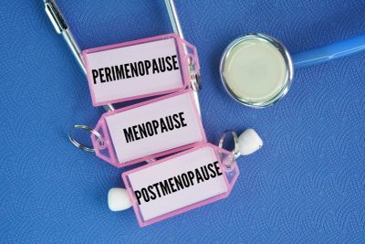Medical tags with stages of menopause and a stethoscope.