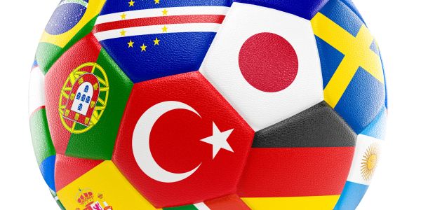 Soccer ball with various international flags on its panels.