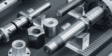 Assortment of precision metal mechanical parts.
