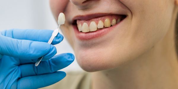 Dental professional performing a procedure in modern clinic.
