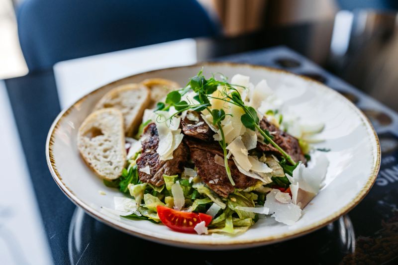 Beefsteak salad on the table. Close-up.
