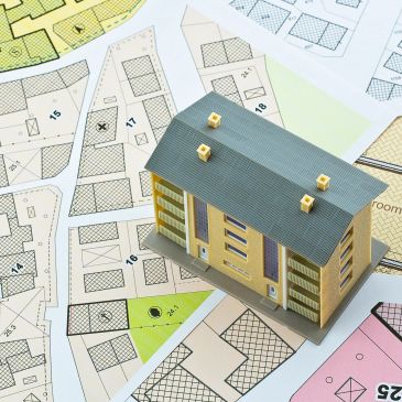 Model house on architectural plans.