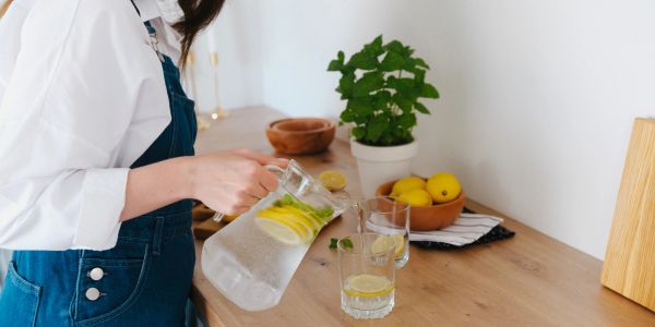 person getting hydrated with water intake