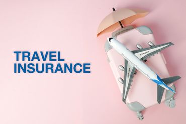 Travel insurance concept with suitcase, umbrella, and airplane.