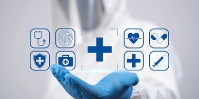 Medical icons hovering over a gloved hand.