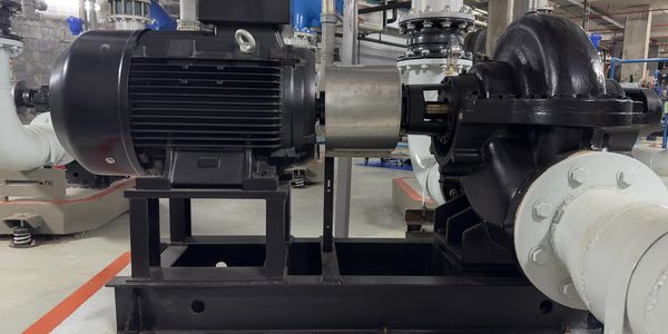 Industrial electric motor coupled with pump.