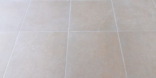 Beige floor tiles with light grout lines.