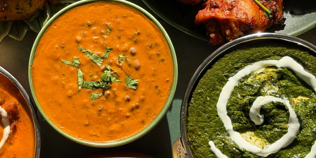 Delicious Indian dishes including dal makhani and palak paneer.