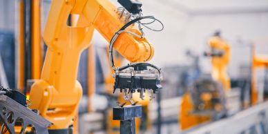 Industrial robot arm working on assembly line.