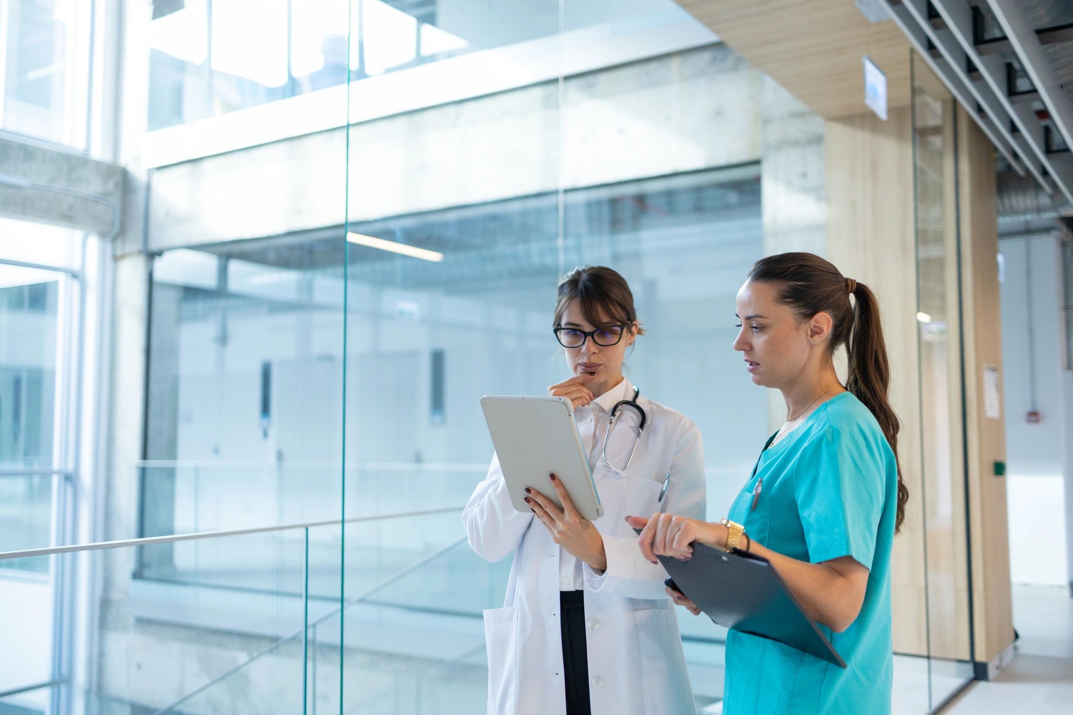 Medical professionals collaborating on tablet — StaffExpress UK
