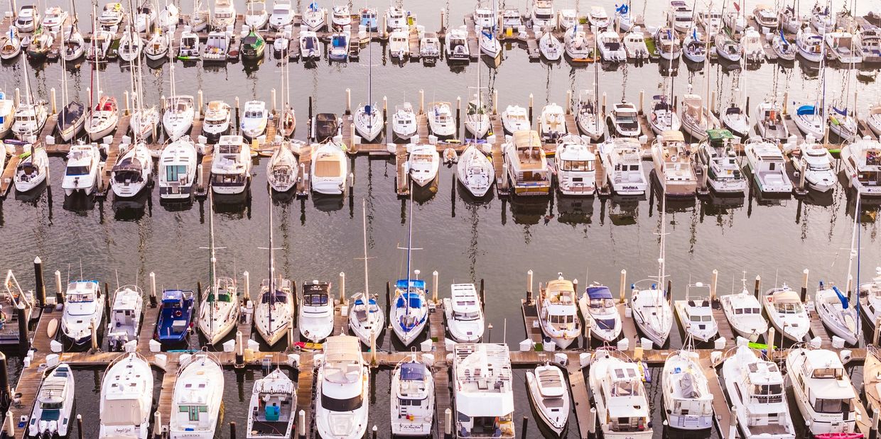Aerial view of many docked boats at a marina.
