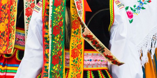Colorful traditional embroidered clothing with floral patterns.