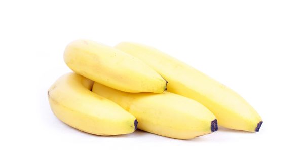 A cluster of ripe yellow bananas isolated on white.