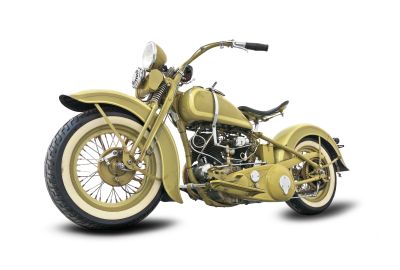 Vintage yellow motorcycle with white wall tires.