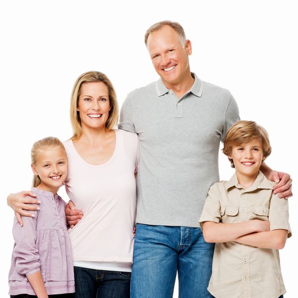 Smiling family of four posing together.