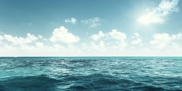 Calm blue ocean under a sunny sky.