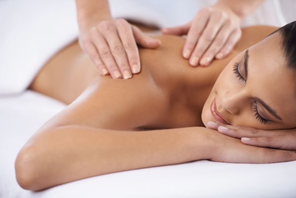 Woman receiving a relaxing back massage.