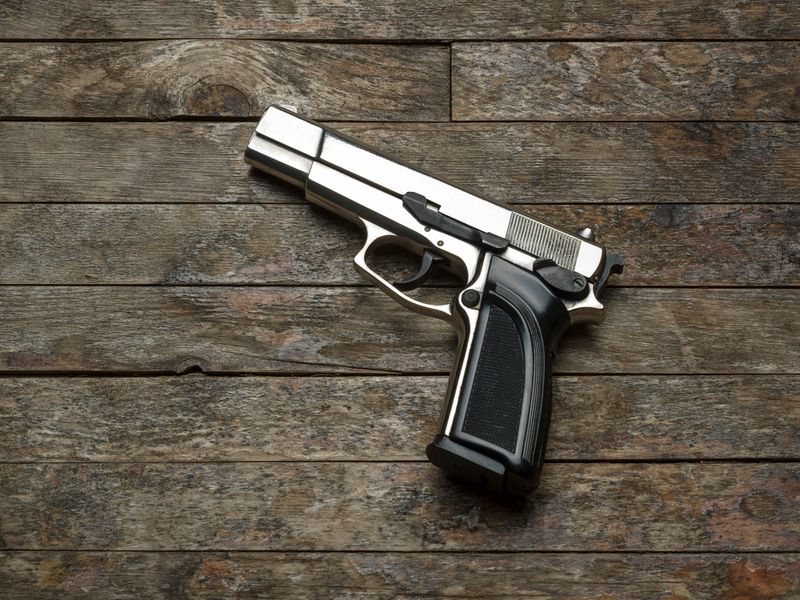 Handgun on wood background