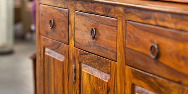 Close-up of wooden cabinet drawers and doors.