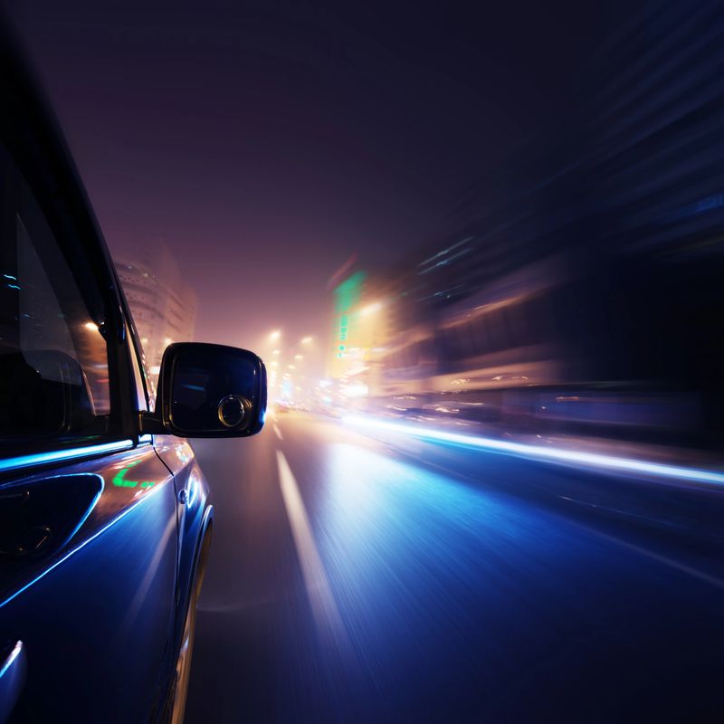 Fast car through street