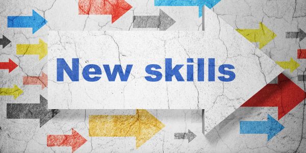 Arrow with "New skills" text surrounded by colorful arrows.