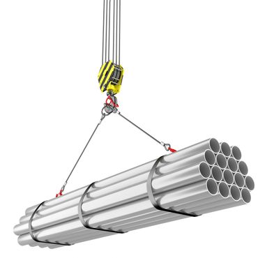 Crane lifting a bundle of metal pipes with cables.
