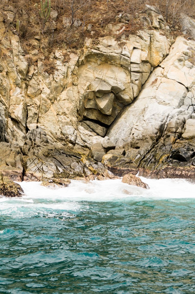 Bahías de Huatulco, Oaxaca, Mexico. Located between the Bays of Organo and Maguey is located this natural formation known as  " The Stone Face ".  This coastal feature is the most famous of Huatulco along with the " Blow Hole " (La Bufadora).