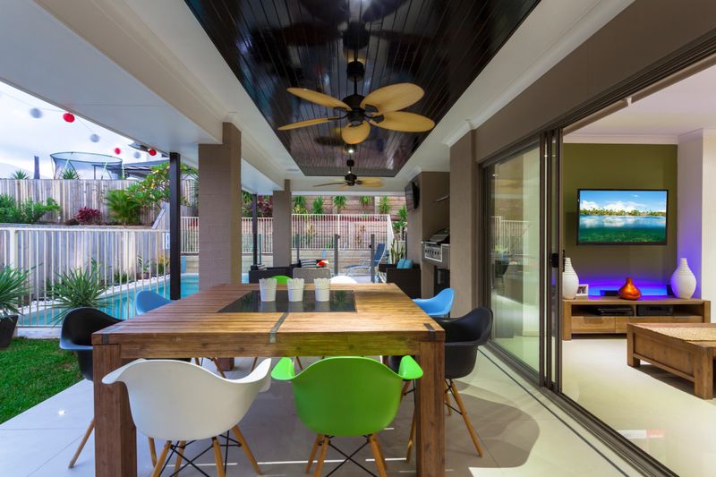 Outdoor entertaining area in stylish home at dusk