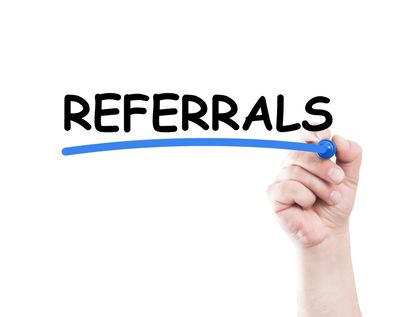 Hand underlining the word "REFERRALS" in blue.