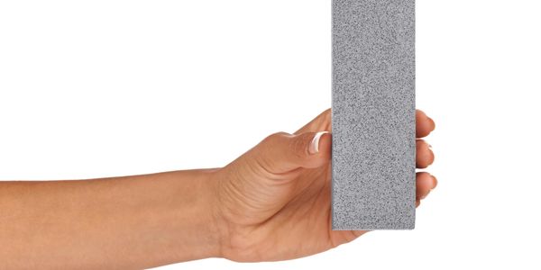 Dental sharpening stone held by a dental hygienist