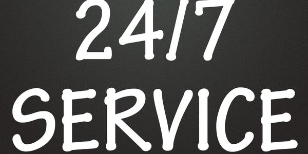 White text saying '24/7 SERVICE' on a black background.