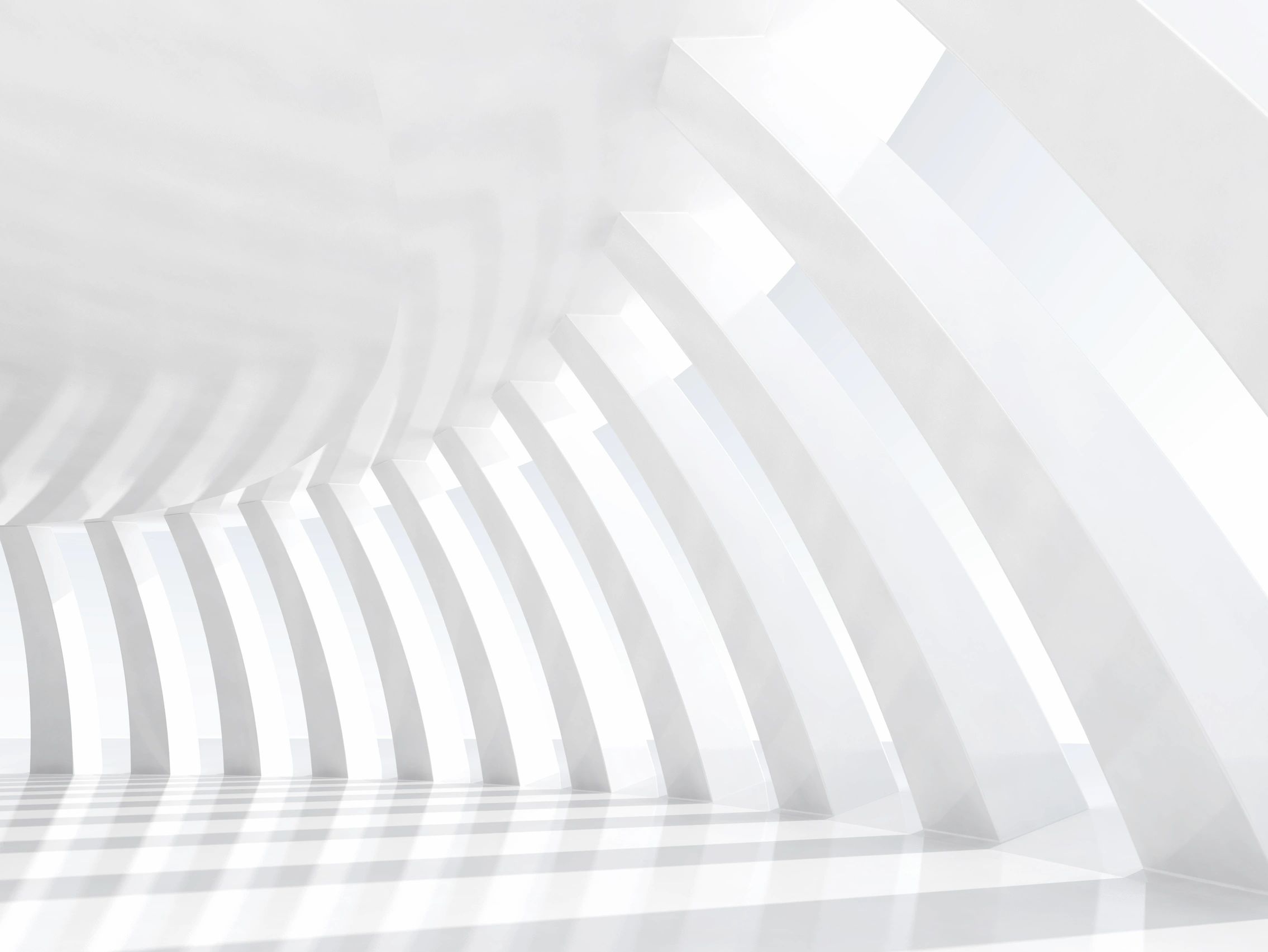 A bright, white modern architectural corridor with repeating vertical beams casting shadows.