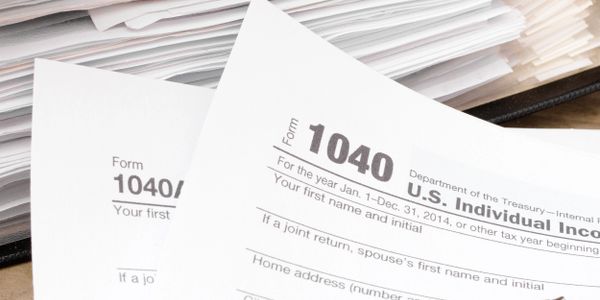 Close-up of U.S. Individual Income Tax Form 1040 documents.