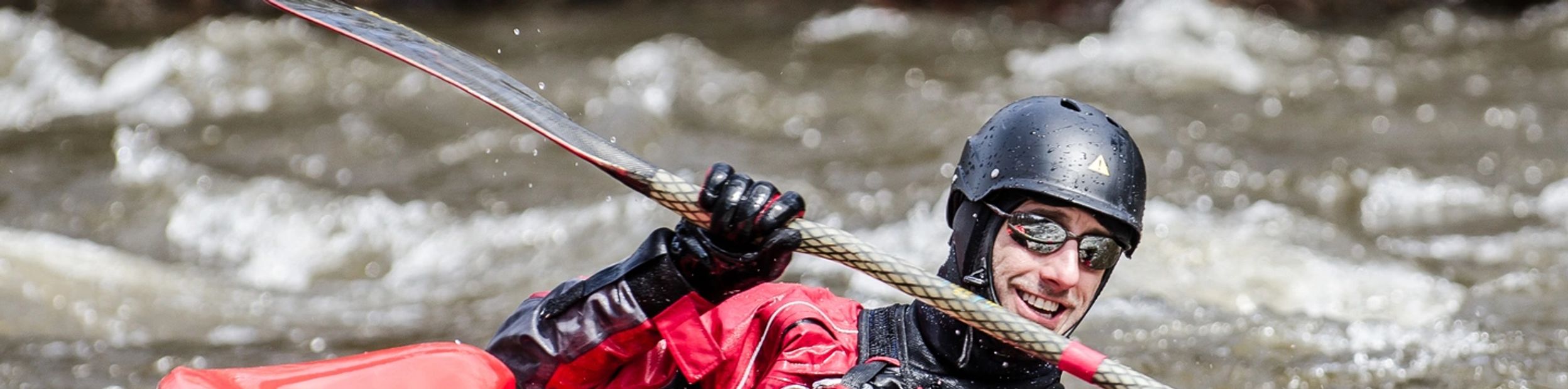 Whitewater kayaking on muddy, energetic rivers - perfect for outdoor lovers.