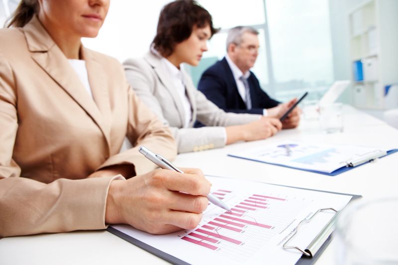 Usual working day at office, business people concentrating on work