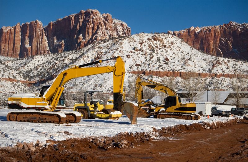 Machinery parked on a snow-covered construction site, in Colorado City, Arizona.