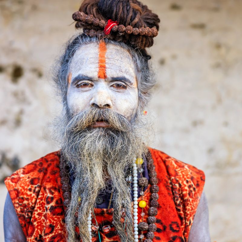 This Sadhu uses ashes of cremated remains to prepare specific white color of his makeup.