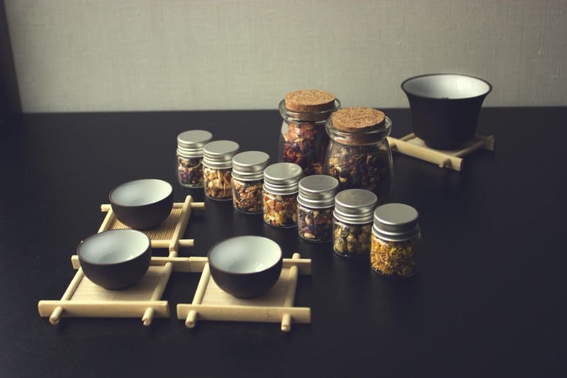 Different types of Chinese tea in glass bottles .