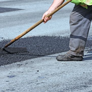 asphalt repair on pot hole 
