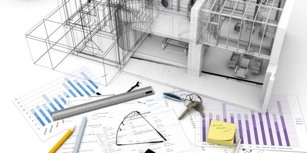Architectural plans, mortgage documents, calculator, and house keys on a desk.