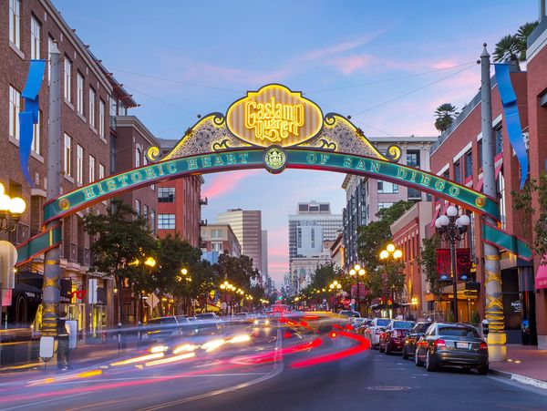 Gaslamp Quarter arch in San Diego at sunset, highlighting a major district for events and shows.
