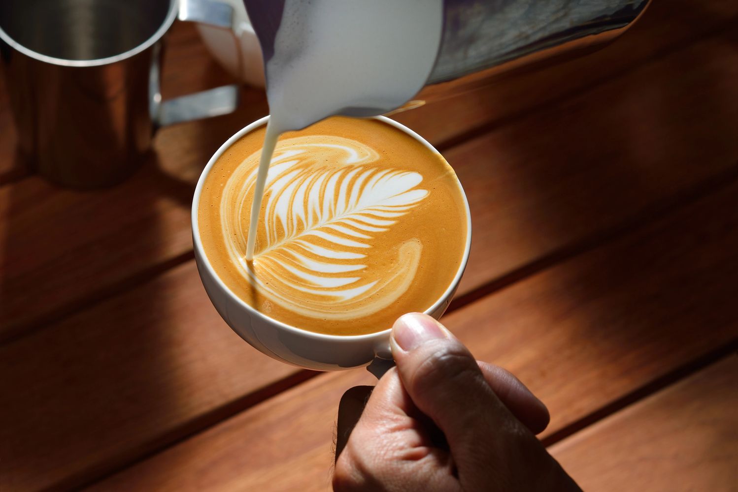 pouring coffee into a cup