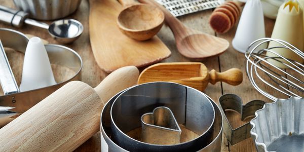 Kitchen table with cookie cutters and utensils