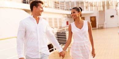 romantic 
couple holding hands on board a cruise ship