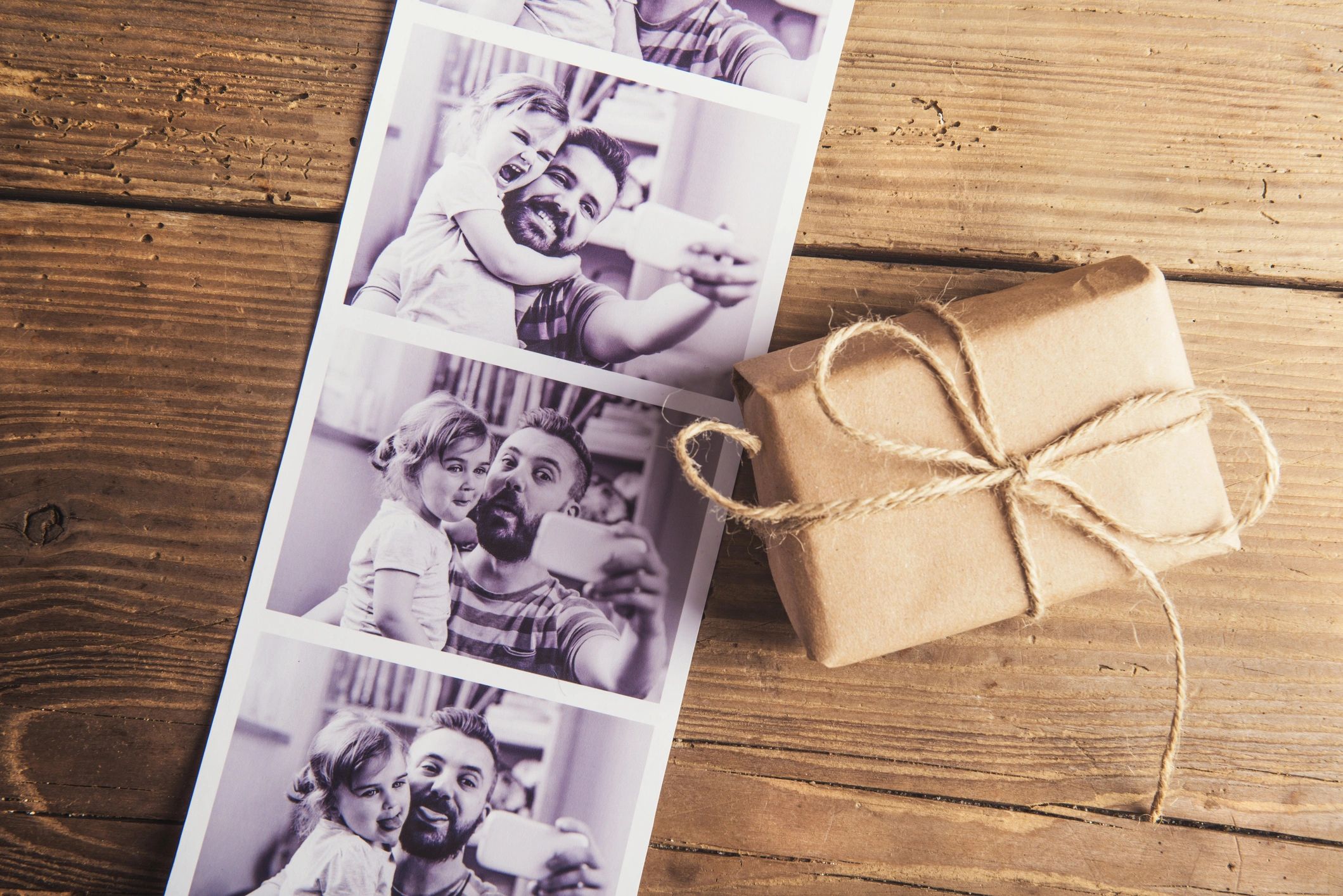 High-quality 2x6 custom photo booth print strips with personalized event branding and layout design.