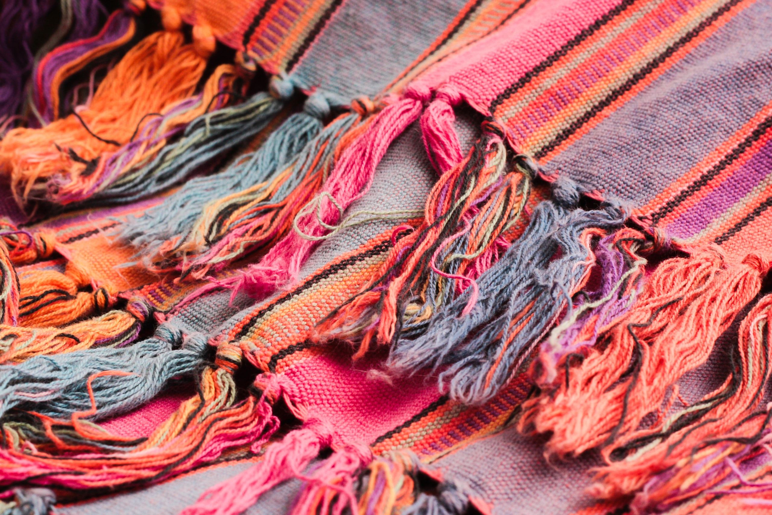 Colorful woven fabric with fringes.