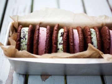 Chocolate cookie ice cream sandwiches with mint chip and strawberry fillings.